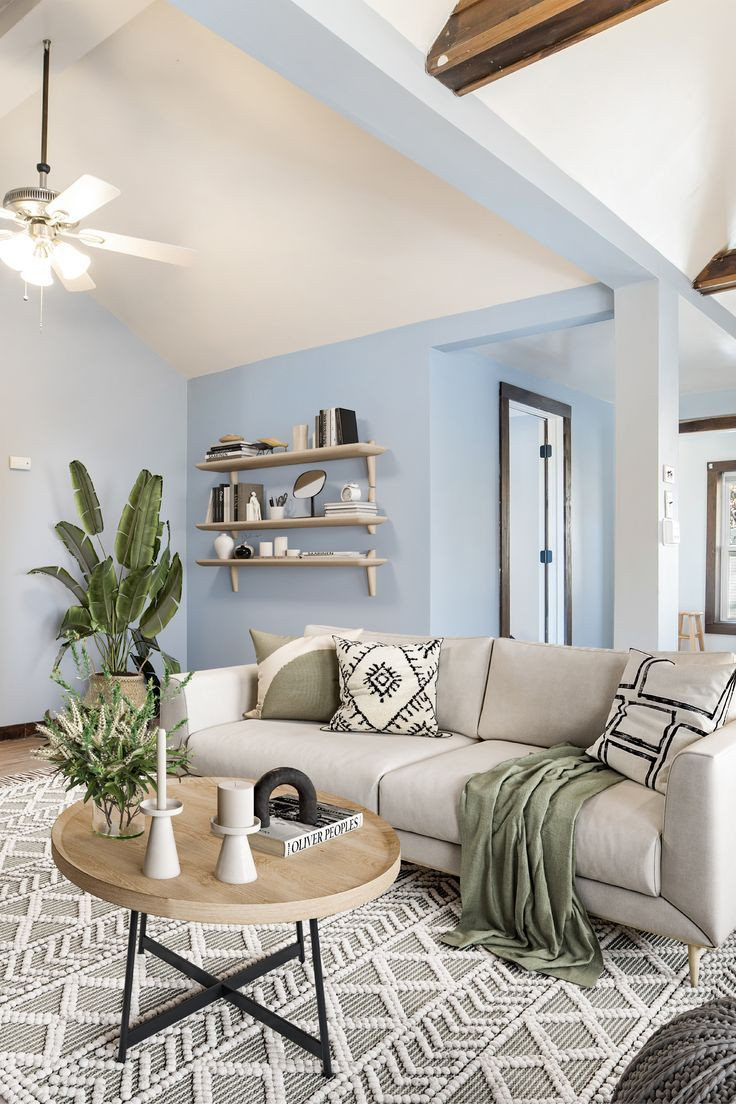Cool Living Room with Soft Neutrals and Green Accents Bright living room with soft neutral tones, natural light, wood furniture, and green accents creating a calm and balanced atmosphere