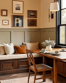 Warm Neutral Dining Nook with Built-In Seating and Natural Light Cozy dining nook with warm neutral tones, built-in bench seating, wood table, and soft natural light creating an inviting and layered atmosphere.