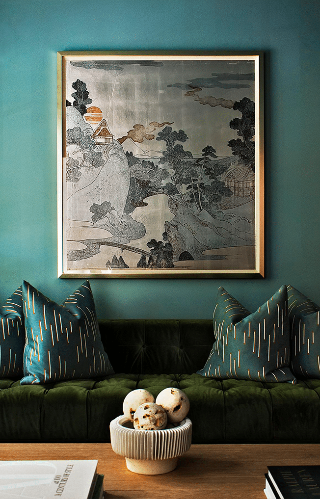 Monochromatic Green Interior with Layered Textures Living room with layered shades of green, featuring a velvet sofa, textured pillows, and tonal wall creating depth through a monochromatic palette