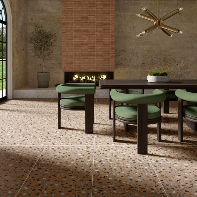 - Marazzi, Curation, Terrazzo look dining Medium Terrazzo-look tile flooring in a dining space with warm neutral tones, creating a grounded and architectural feel with minimal visual noise