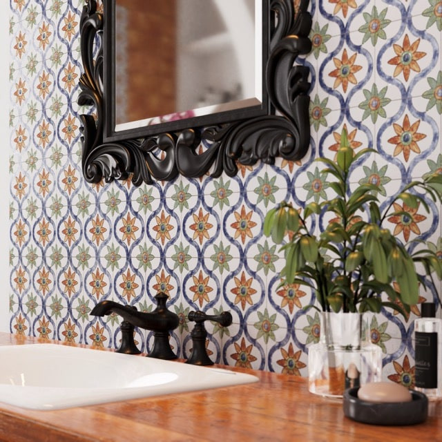 Merola Tile_Sentier_bath-backsplash- Medium Handcrafted patterned tile backsplash with warm tones and intricate motifs, showcasing artisan detail and variation in a bathroom setting