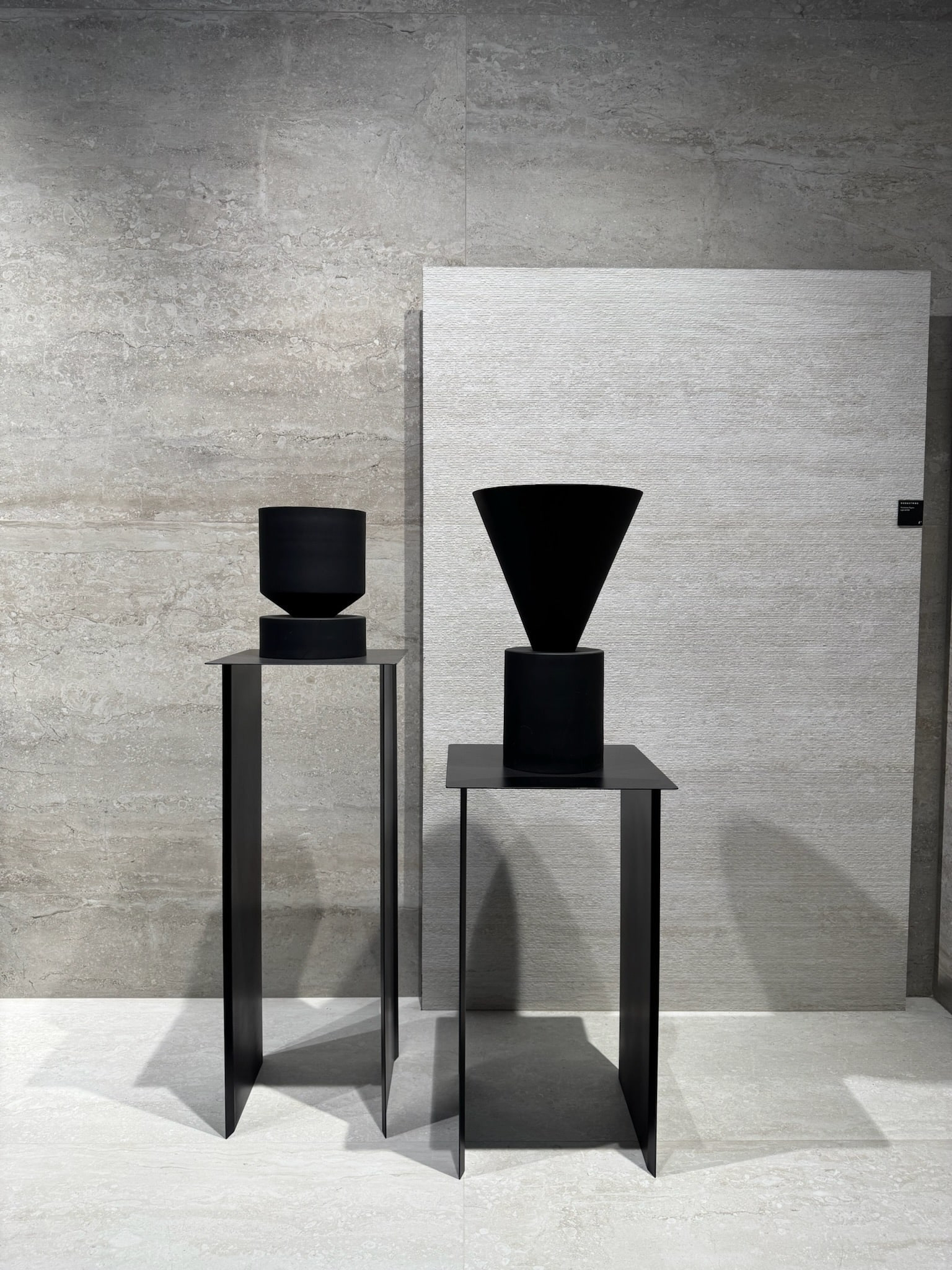 tile wall covering Large-format matte tile wall in soft neutral tones with minimal grout lines, creating a quiet and architectural backdrop with sculptural