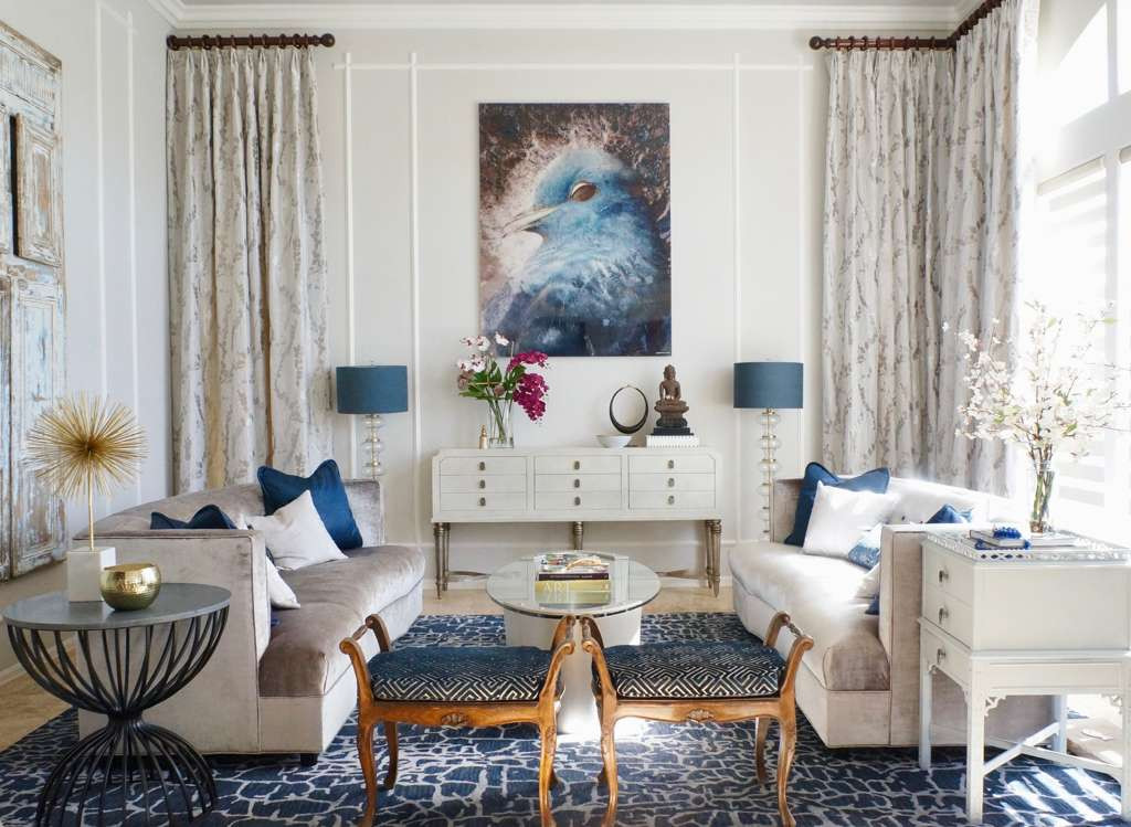 Luxury Living Room by Fabiola Avelino Interiors Luxury living room with warm neutrals and blue accents designed by Fabiola Avelino